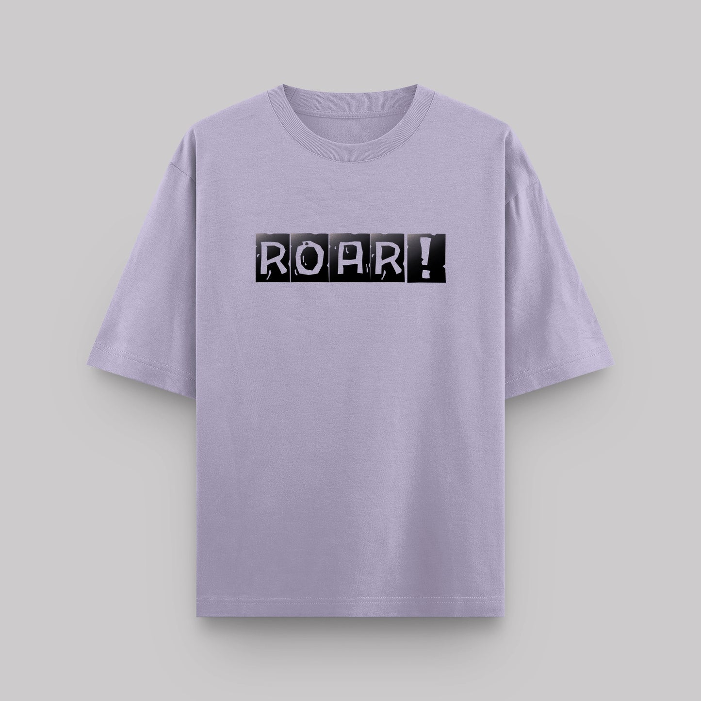 Lavender t-shirt with 'ROAR!' print on a light gray background