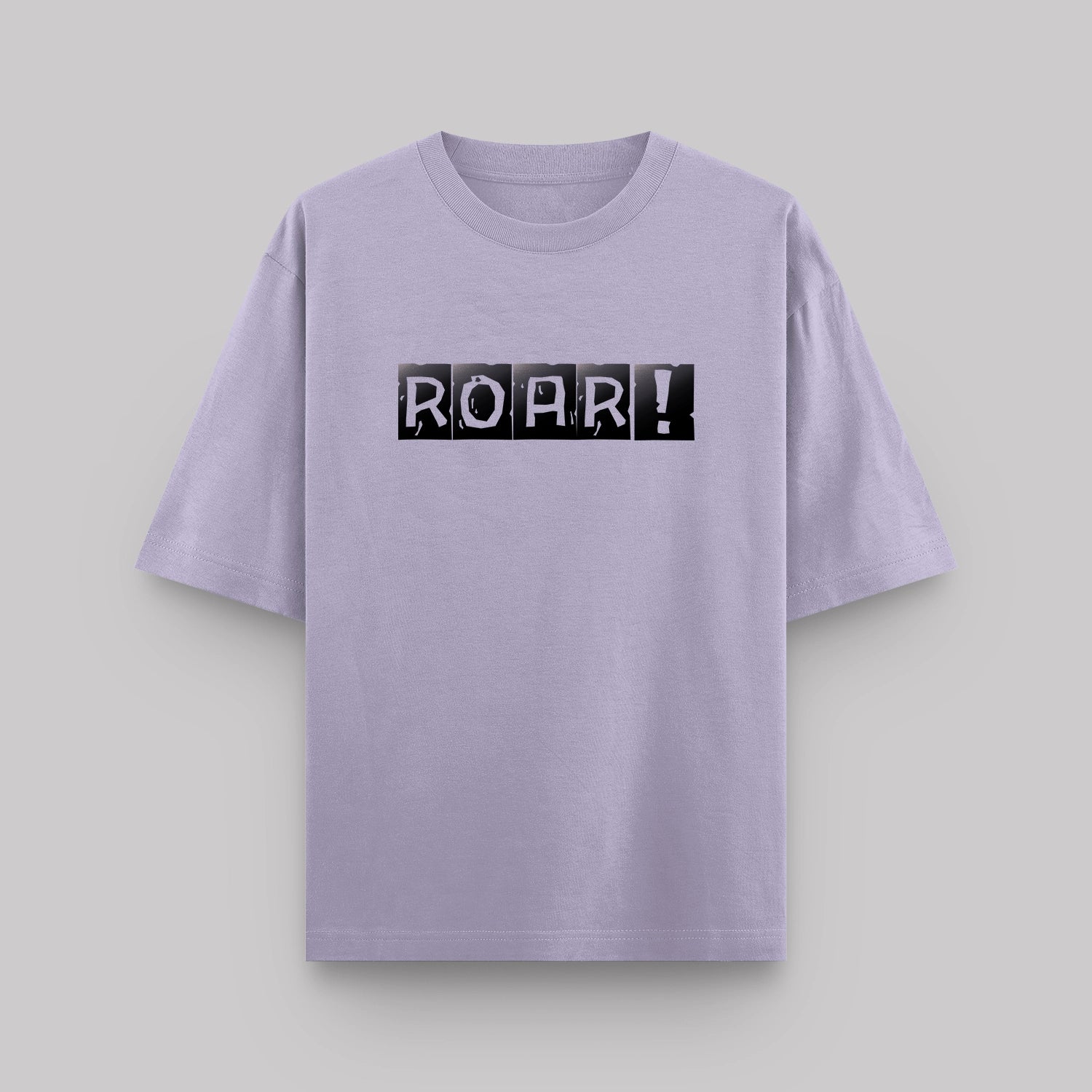 Lavender t-shirt with 'ROAR!' print on a light gray background
