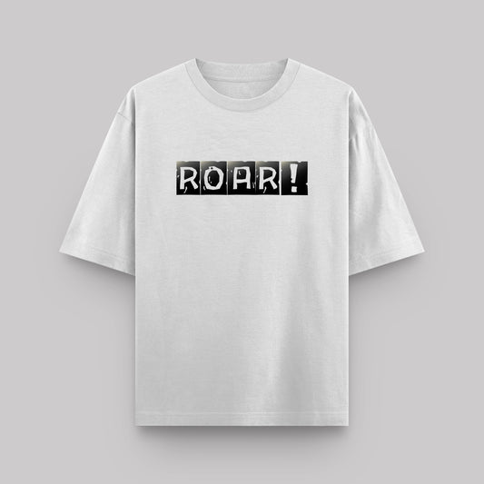 White t-shirt with 'ROAR!' print on a gray background