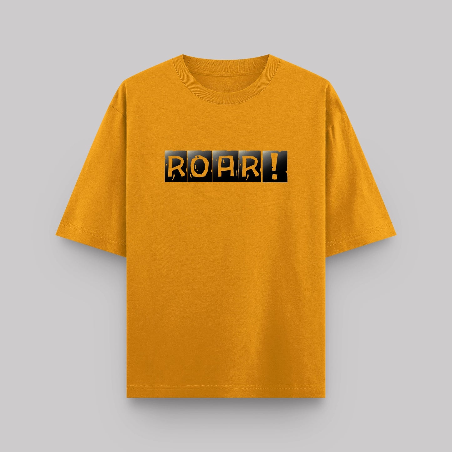 Yellow t-shirt with 'ROAR!' text on a gray background