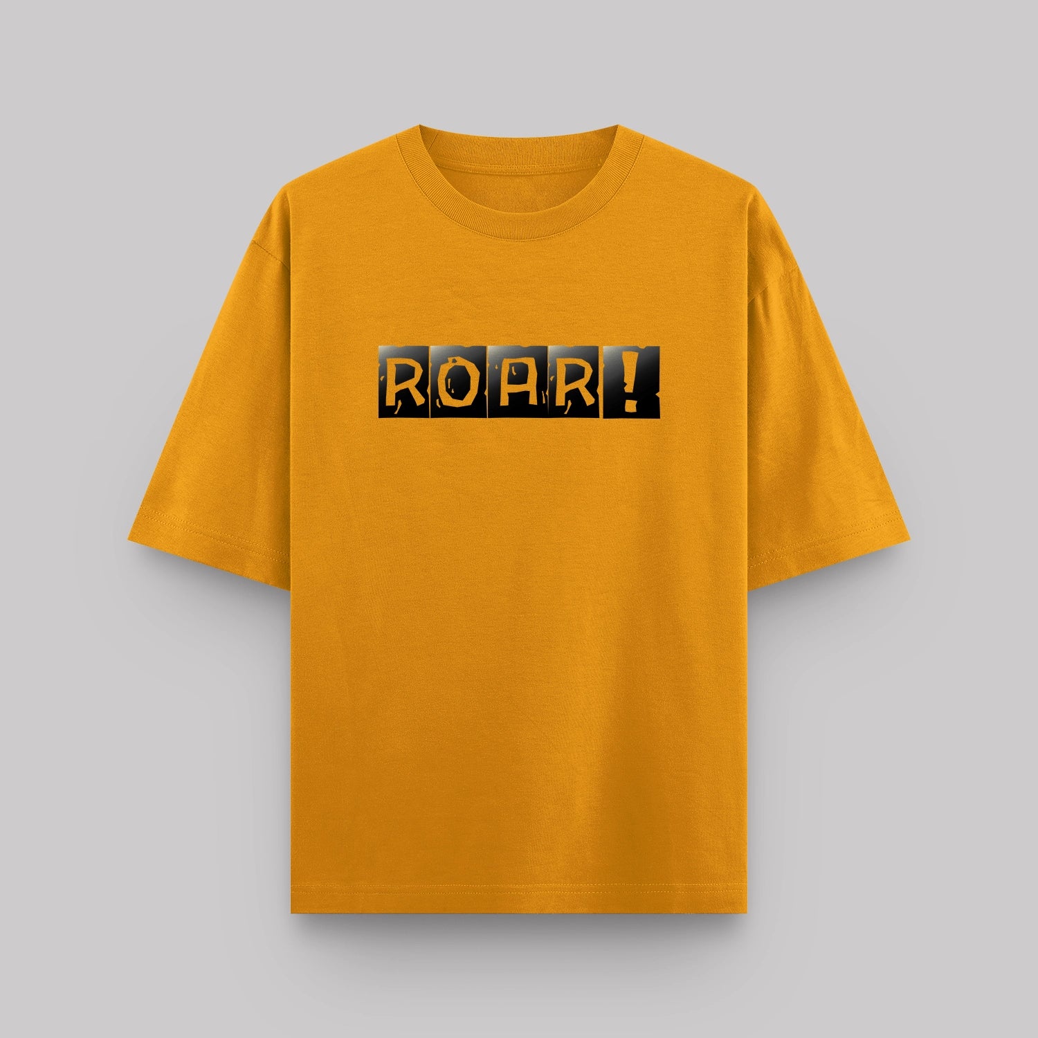 Yellow t-shirt with 'ROAR!' text on a gray background