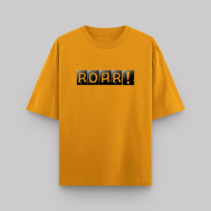 Yellow t-shirt with 'ROAR!' text on a gray background