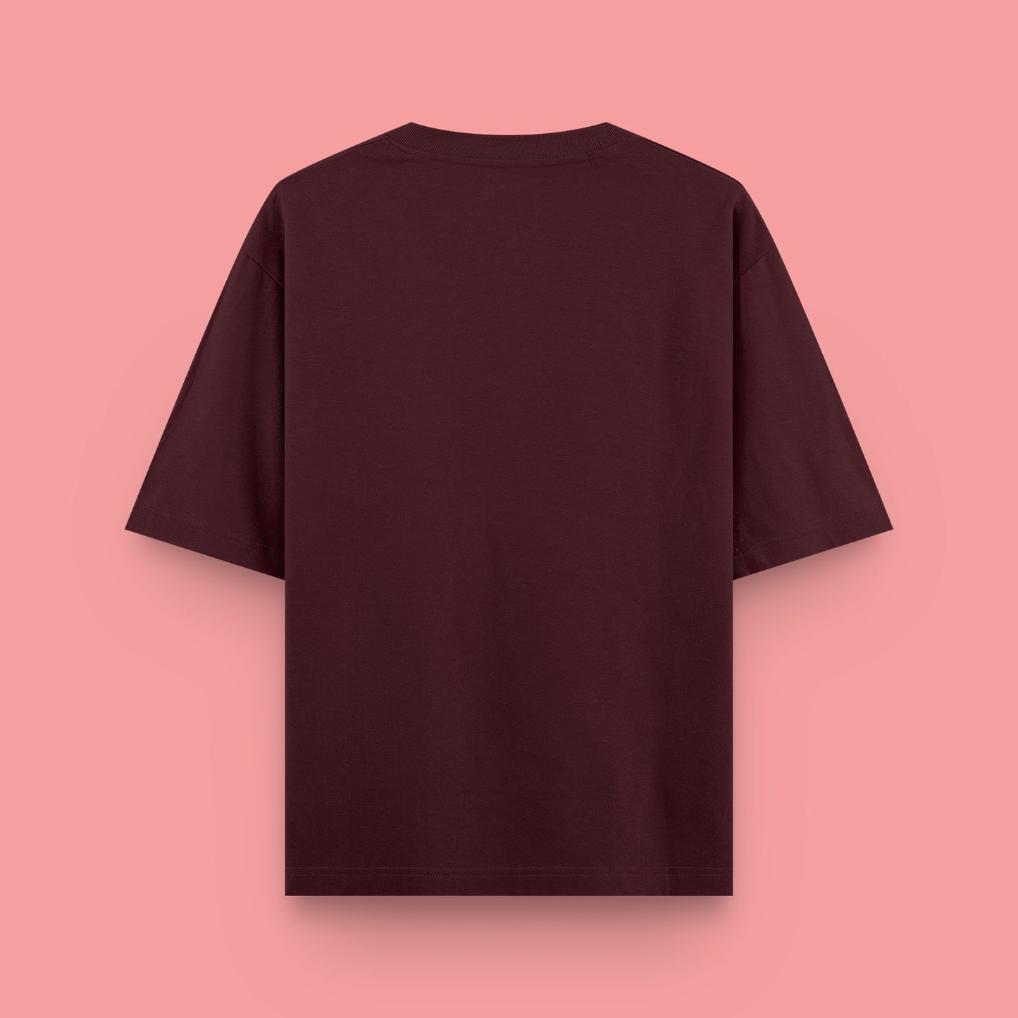 Maroon t-shirt on a pink background
