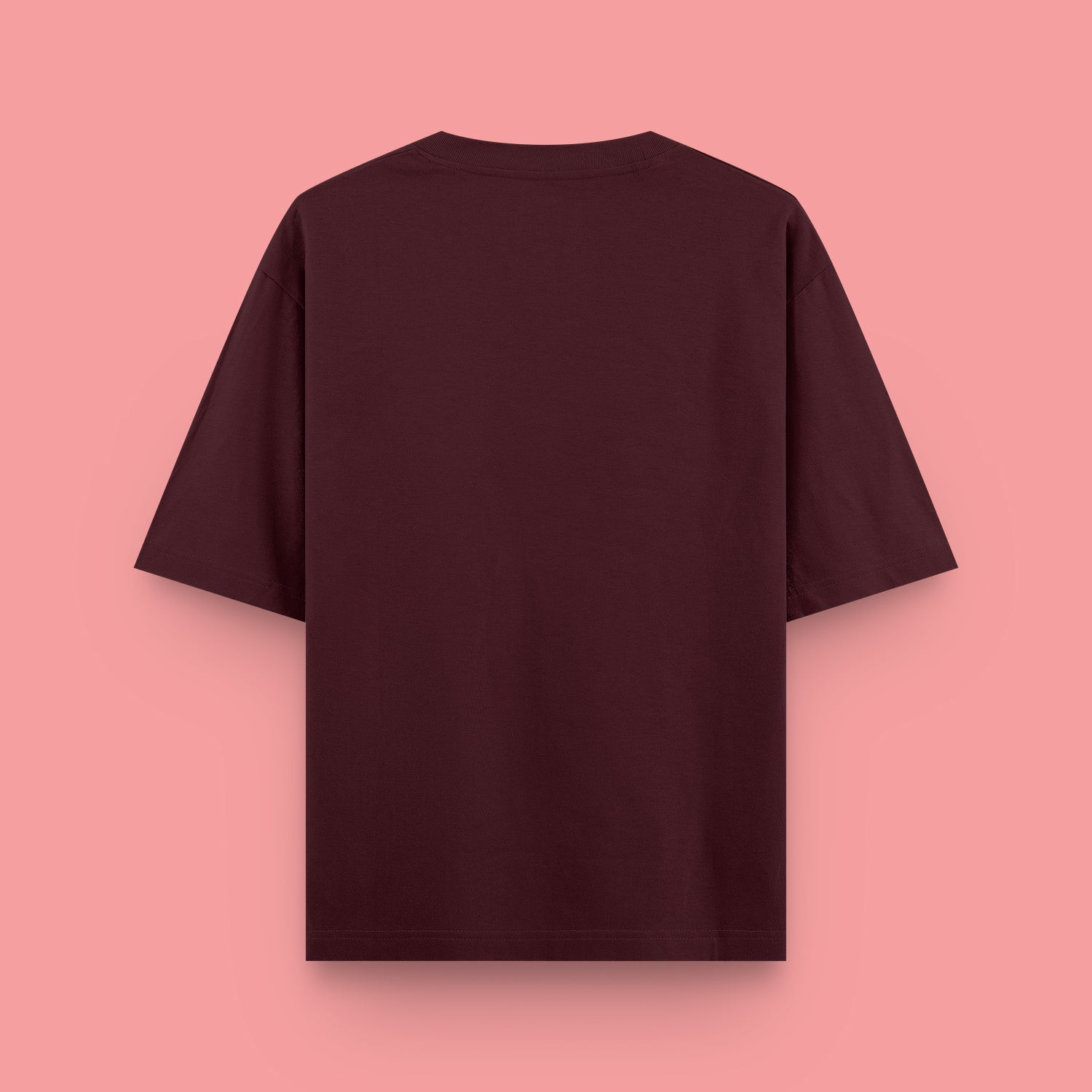 Maroon t-shirt on a pink background