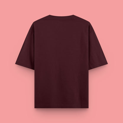 Maroon t-shirt on a pink background