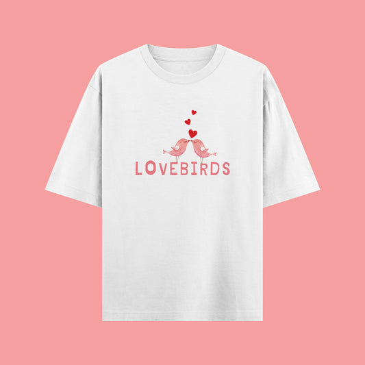 White t-shirt with 'LOVEBIRDS' design on a pink background