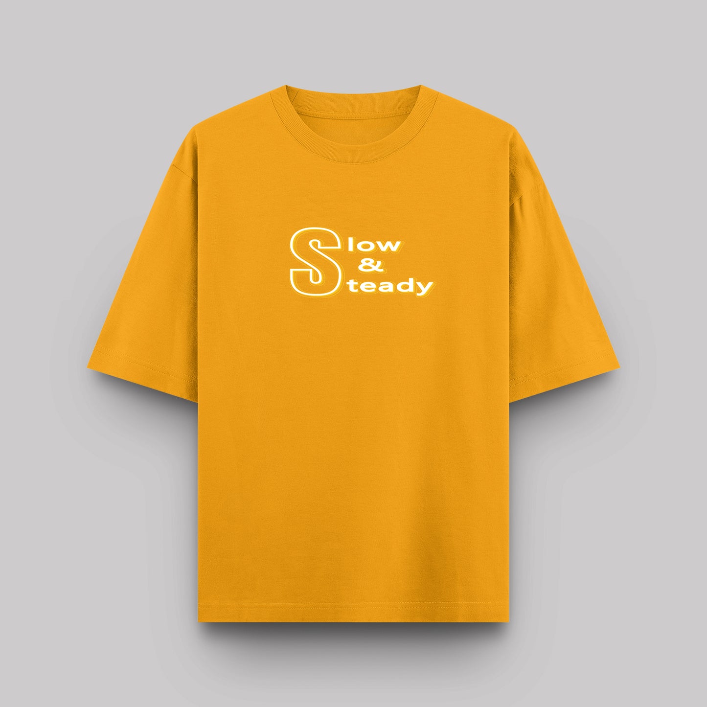 Yellow t-shirt with 'Slow & Steady' text on a gray background