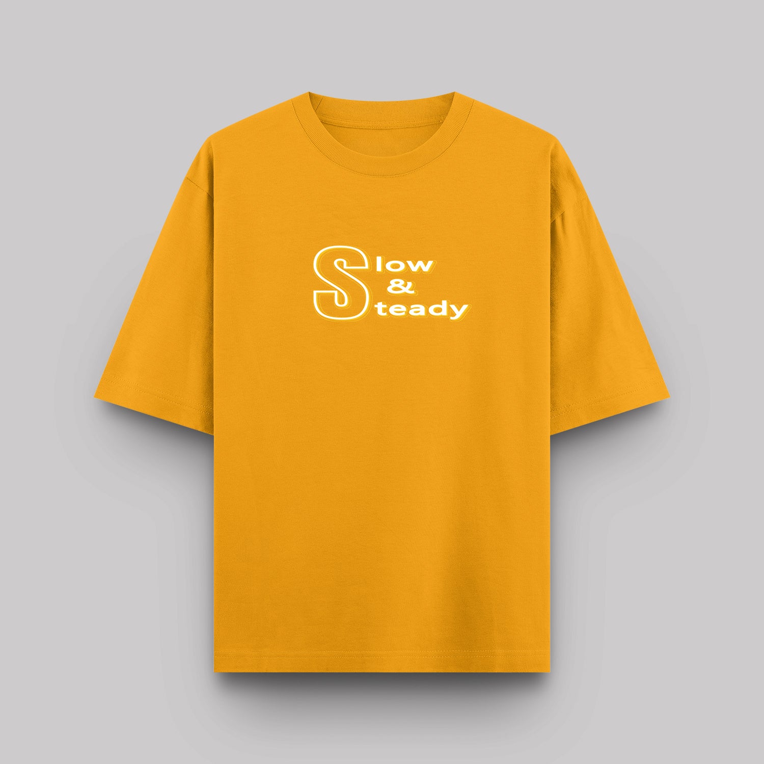 Yellow t-shirt with 'Slow & Steady' text on a gray background