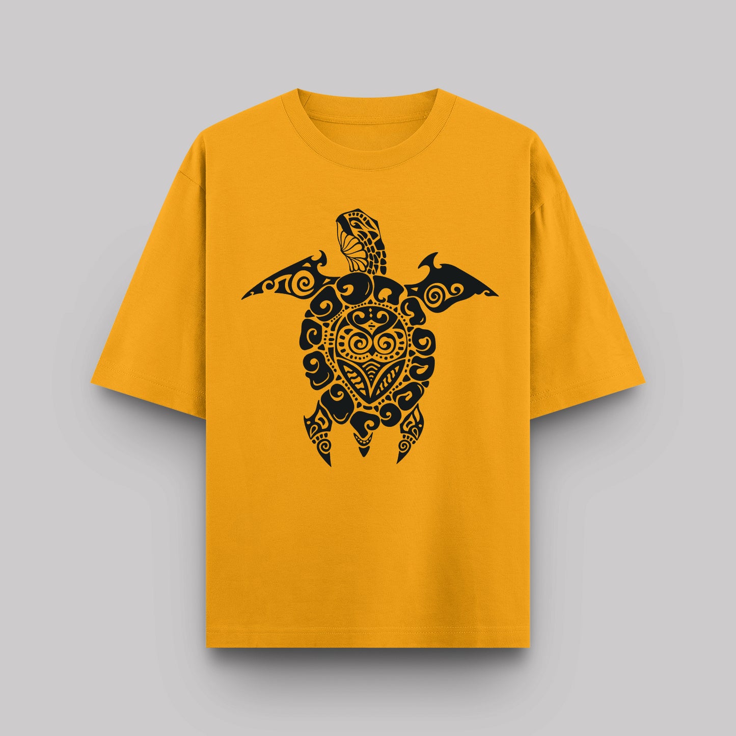 Yellow t-shirt with a black turtle design on a gray background