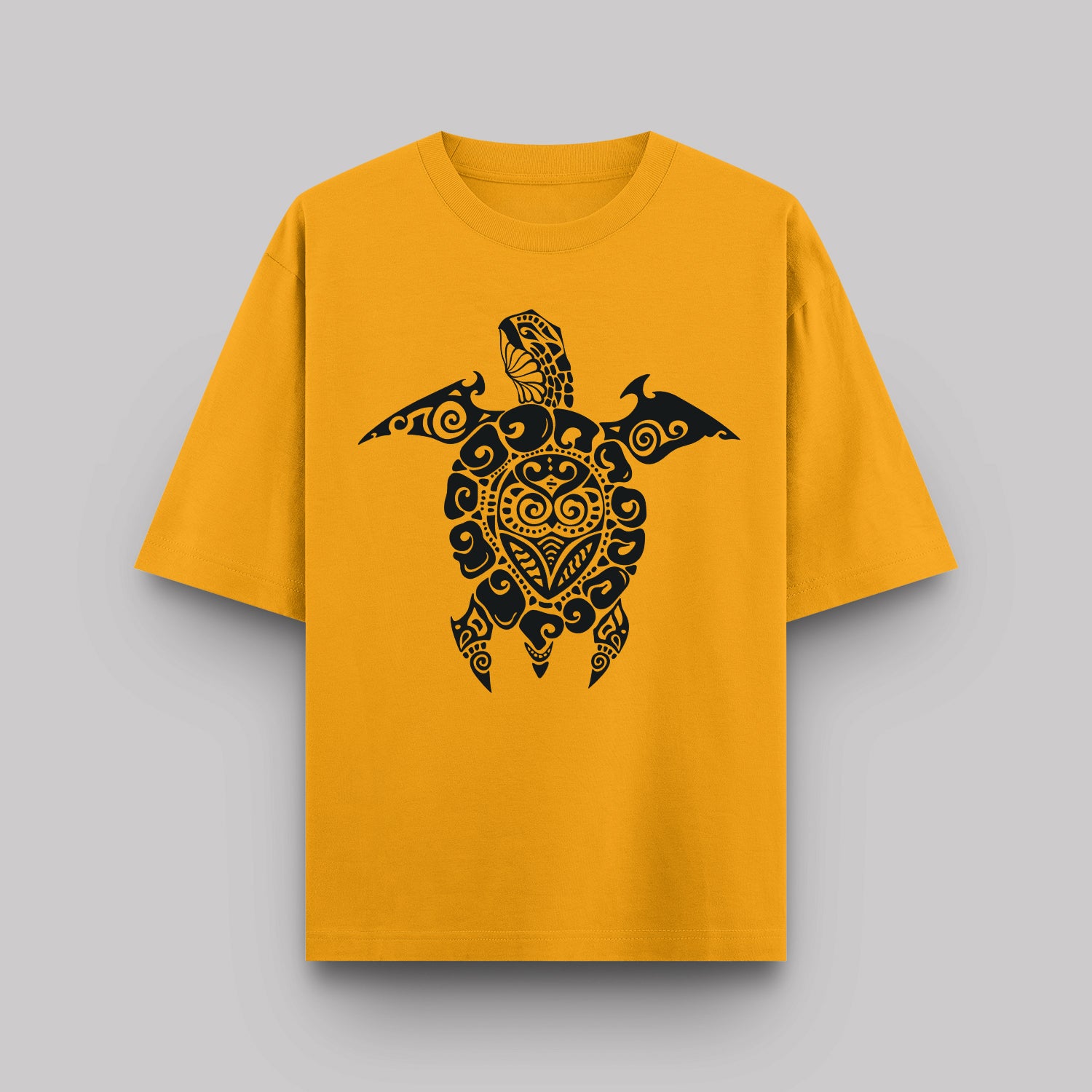 Yellow t-shirt with a black turtle design on a gray background